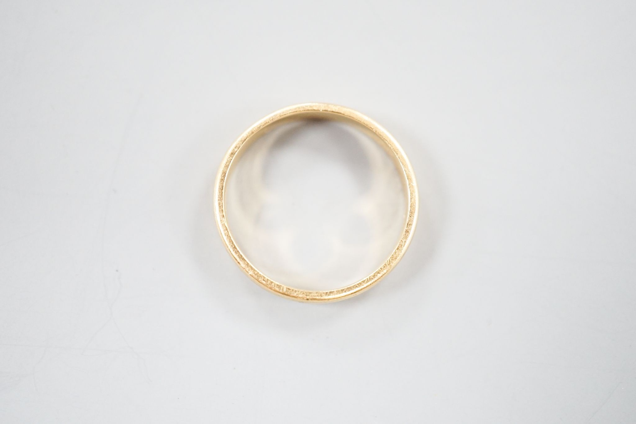 A 22ct wedding band, size N, 4.3 grams.